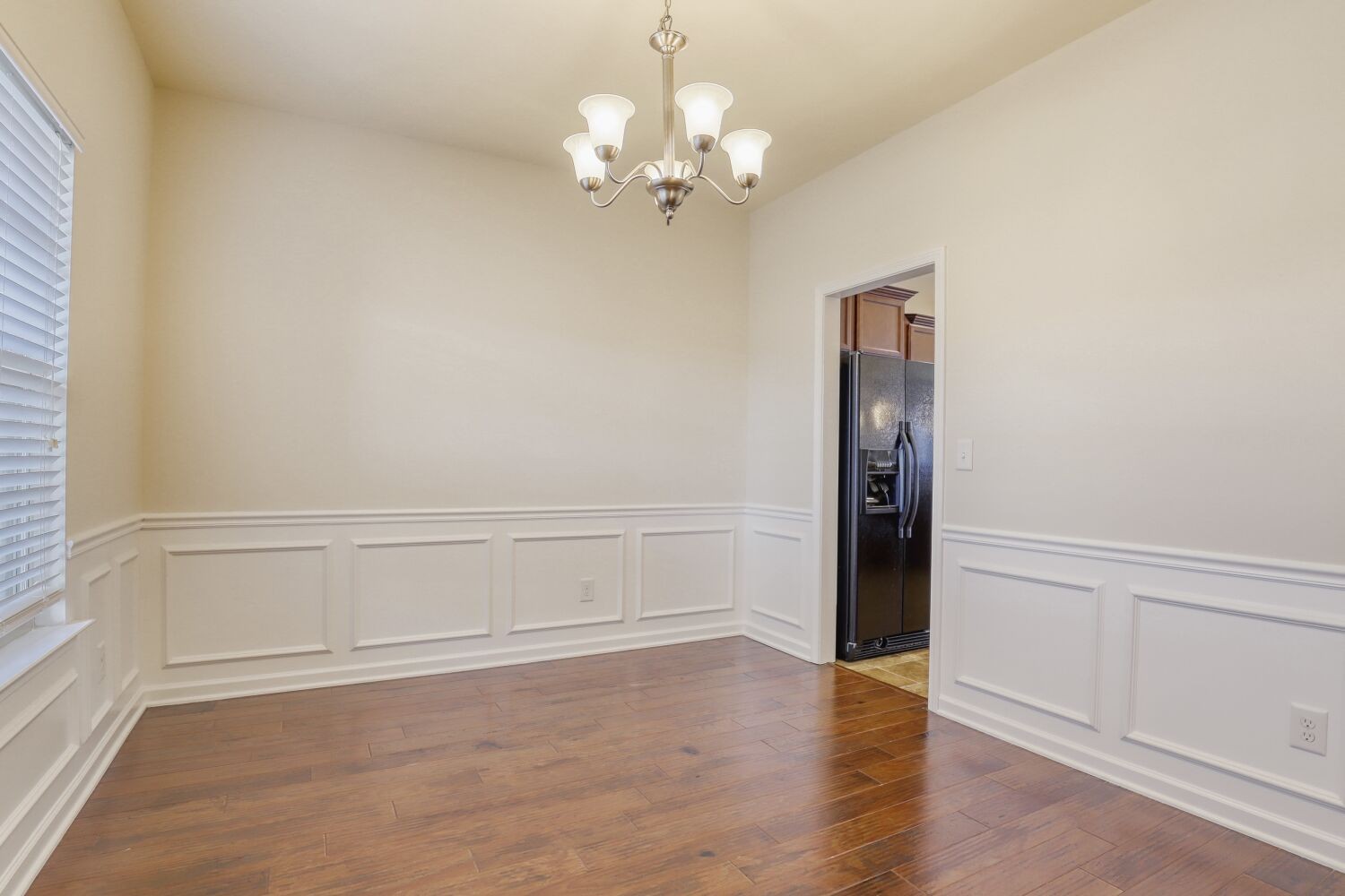 1011 Beverly Lane Spring Hill, TN 37174 - Photo 5 of 20 a view of an empty room with wooden floor and a window