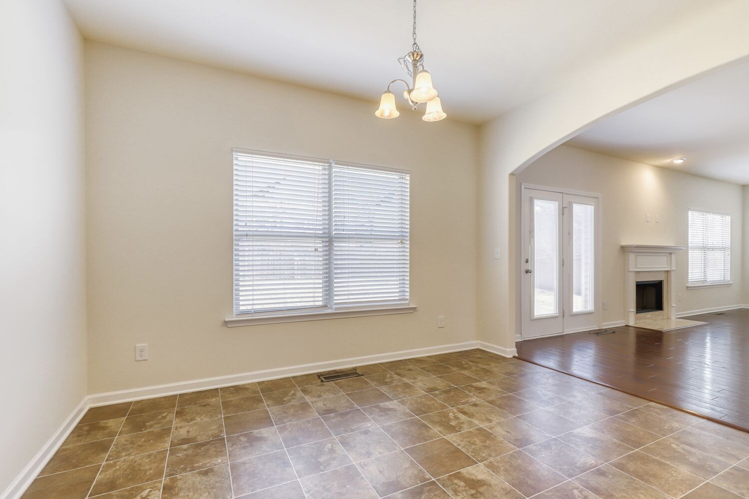 1011 Beverly Lane Spring Hill, TN 37174 - Photo 6 of 20 a view of an empty room with wooden floor and a window