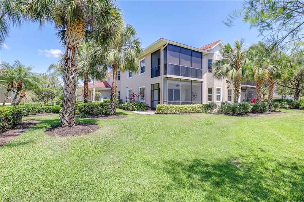 7865 Hawthorne Drive, Unit 402 Naples, FL 34113 - Photo 26 of 33 a view of a house with a yard