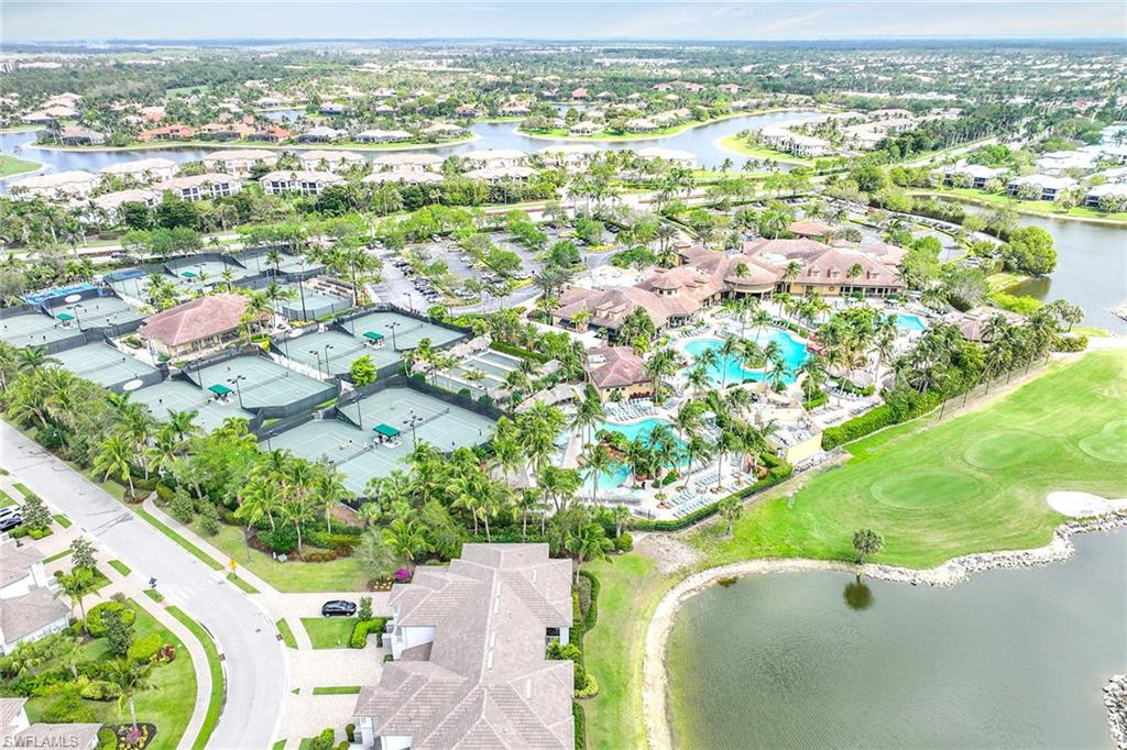 7865 Hawthorne Drive, Unit 402 Naples, FL 34113 - Photo 28 of 33 an aerial view of residential houses with outdoor space and swimming pool