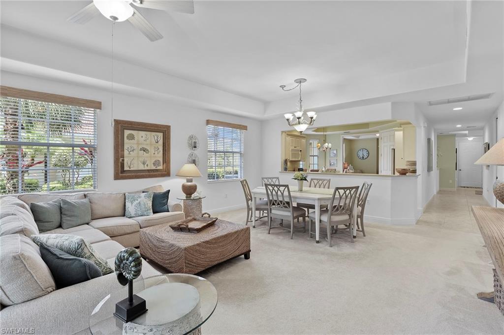 7865 Hawthorne Drive, Unit 402 Naples, FL 34113 - Photo 8 of 33 a living room with furniture and a large window