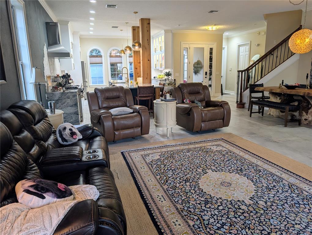 7429 Gathering Court Reunion, FL 34747 - Photo 11 of 40 a living room with furniture or couch and a coffee table