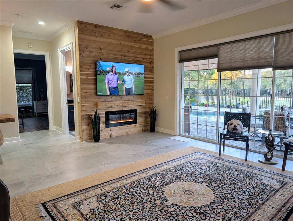 7429 Gathering Court Reunion, FL 34747 - Photo 12 of 40 a living room with furniture and a fireplace