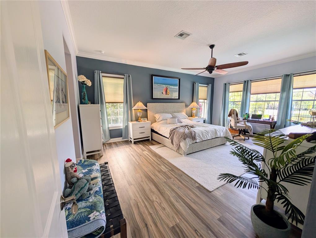 7429 Gathering Court Reunion, FL 34747 - Photo 14 of 40 a bedroom with furniture and a large window