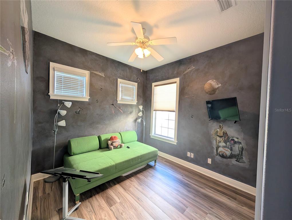 7429 Gathering Court Reunion, FL 34747 - Photo 29 of 40 a living room with furniture and a window