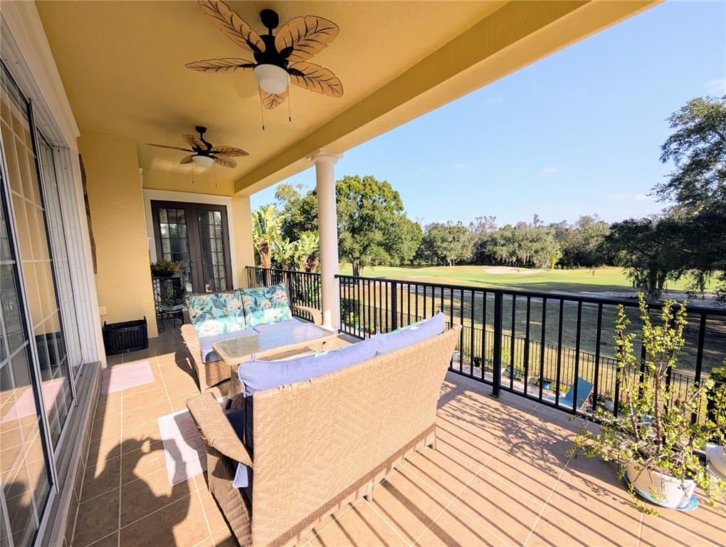 7429 Gathering Court Reunion, FL 34747 - Photo 38 of 40 a view of a patio with a table and chairs