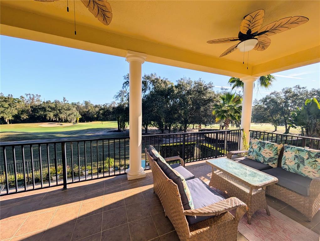 7429 Gathering Court Reunion, FL 34747 - Photo 39 of 40 a view of a balcony with a table and chairs