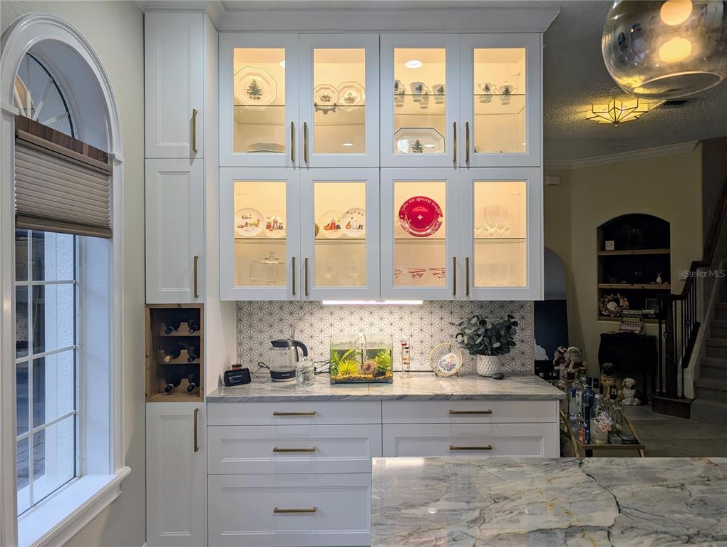 7429 Gathering Court Reunion, FL 34747 - Photo 7 of 40 a kitchen with a stove a sink and a window