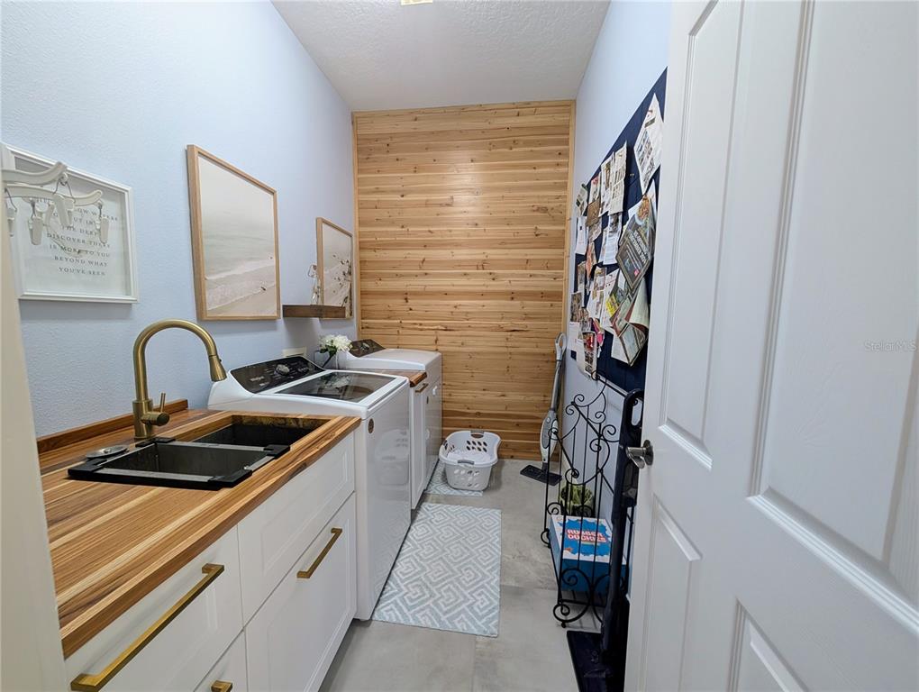 7429 Gathering Court Reunion, FL 34747 - Photo 9 of 40 a kitchen with a refrigerator and a sink