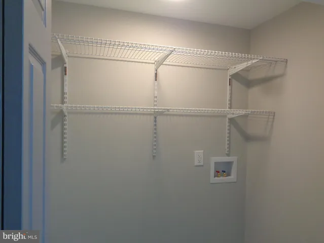 a bathroom with a tub sink and window