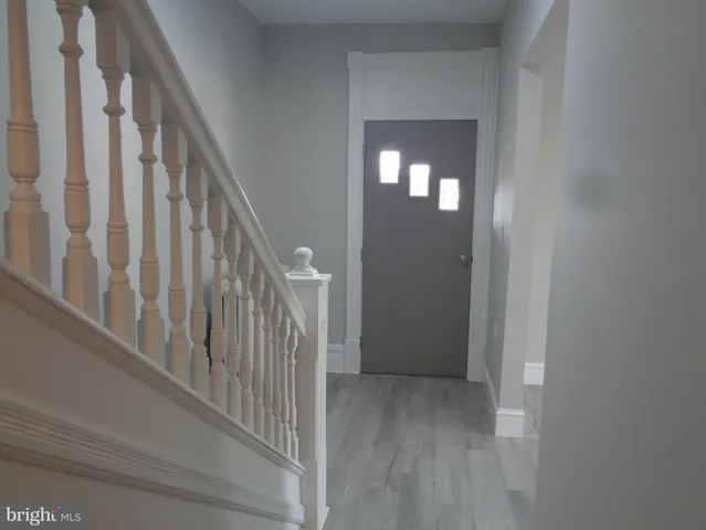 a bathroom with a bathtub sink vanity and mirror