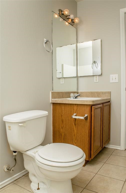 2038 Rustling Trees Way Spring, TX 77373 - Photo 11 of 20 a bathroom with a granite countertop toilet a sink and mirror
