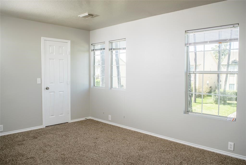 2038 Rustling Trees Way Spring, TX 77373 - Photo 12 of 20 an empty room with windows
