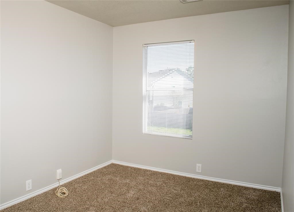 2038 Rustling Trees Way Spring, TX 77373 - Photo 18 of 20 an empty room with a window