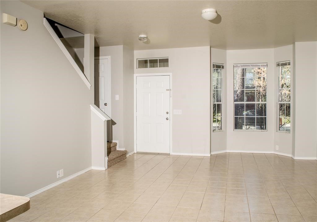 2038 Rustling Trees Way Spring, TX 77373 - Photo 4 of 20 a view of a hallway with wooden floor and entryway