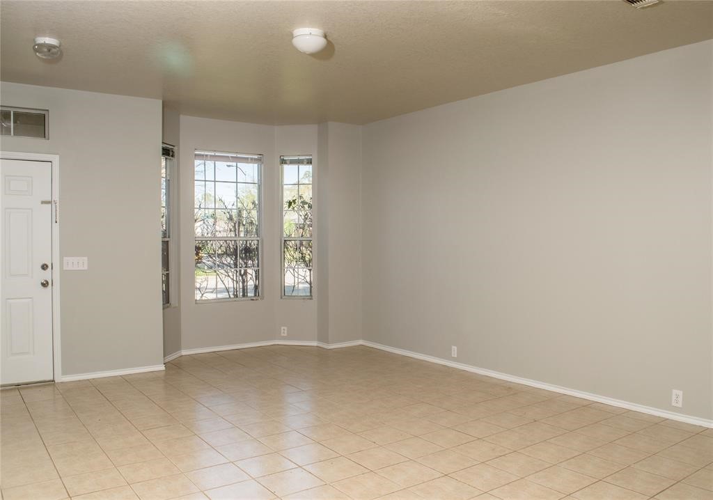 2038 Rustling Trees Way Spring, TX 77373 - Photo 5 of 20 an empty room with windows