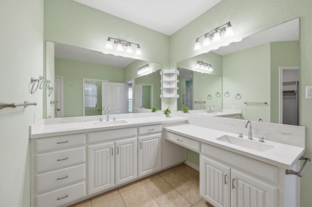 1616 Nash-Howard Road Waxahachie, TX 75165 - Photo 22 of 36 a bathroom with a sink double vanity and a mirror