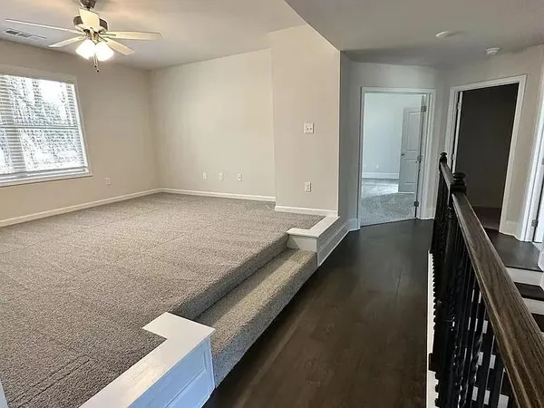 a view of a hallway with a workspace