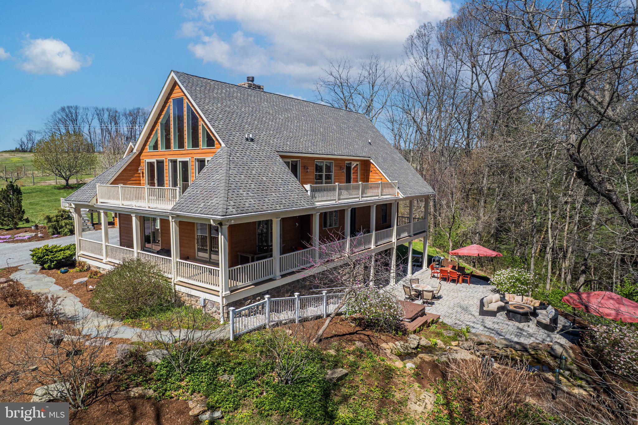 a aerial view of a house with swimming pool and sitting area