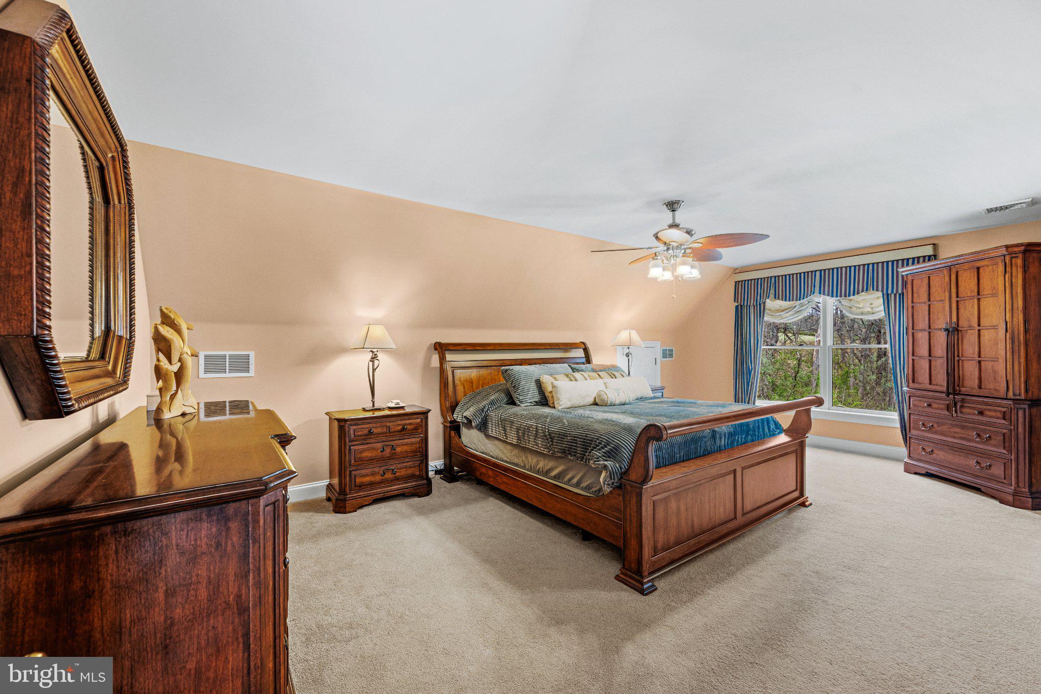 21042 Millers Mill Road Freeland, MD 21053 - Photo 106 of 122 a bedroom with a bed couch and flat tv screen