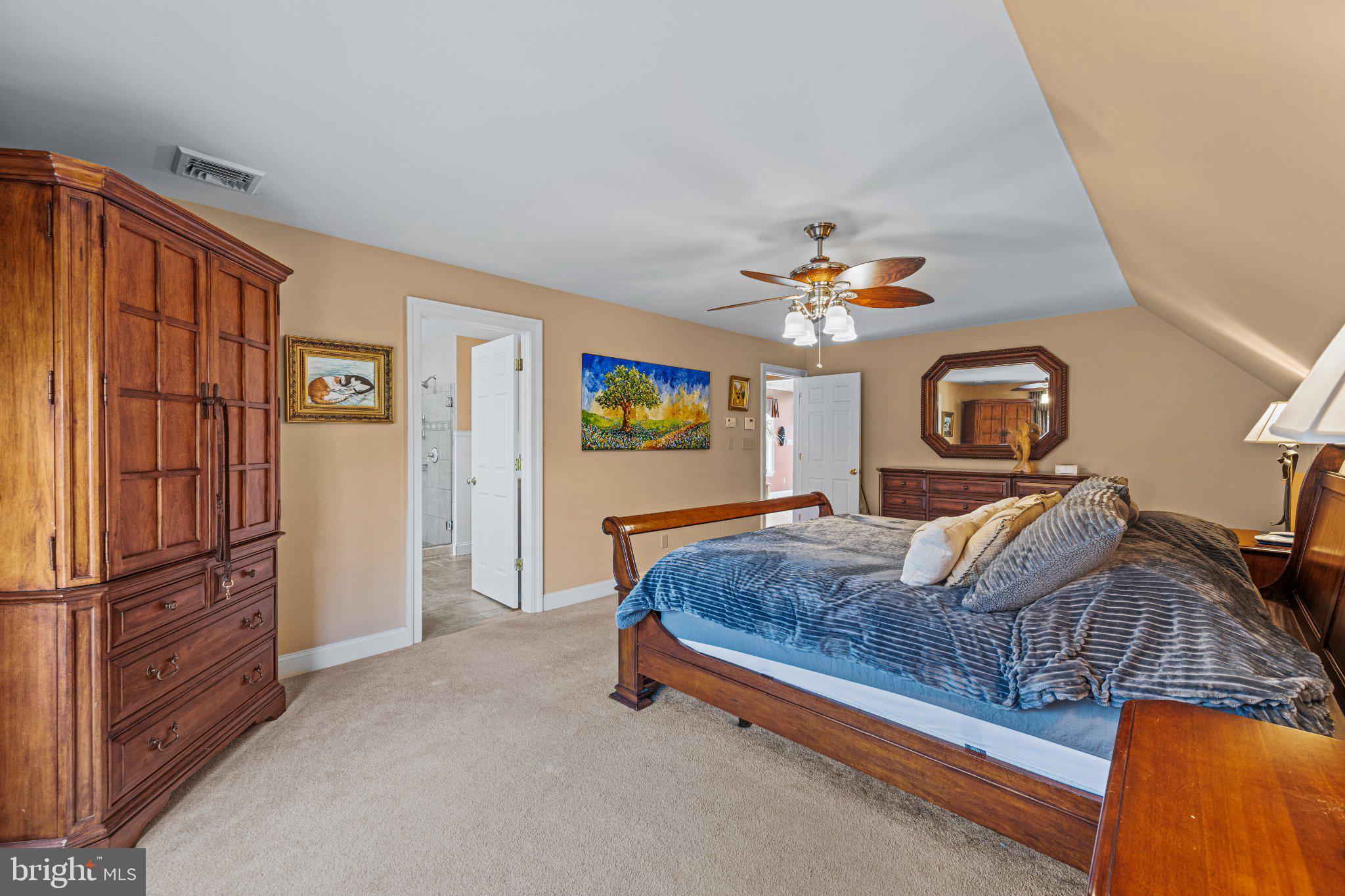 21042 Millers Mill Road Freeland, MD 21053 - Photo 108 of 122 a bedroom with a bed and dresser with mirror