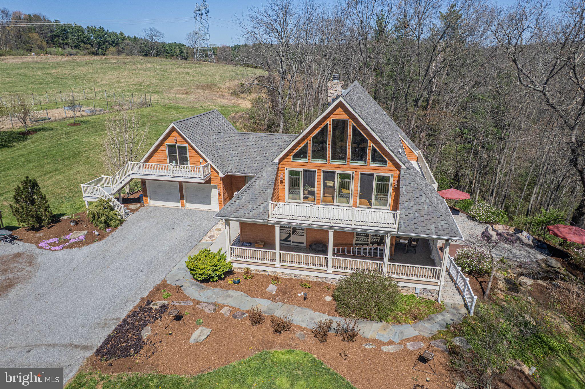 21042 Millers Mill Road Freeland, MD 21053 - Photo 20 of 122 a front view of a house with a yard and lake view