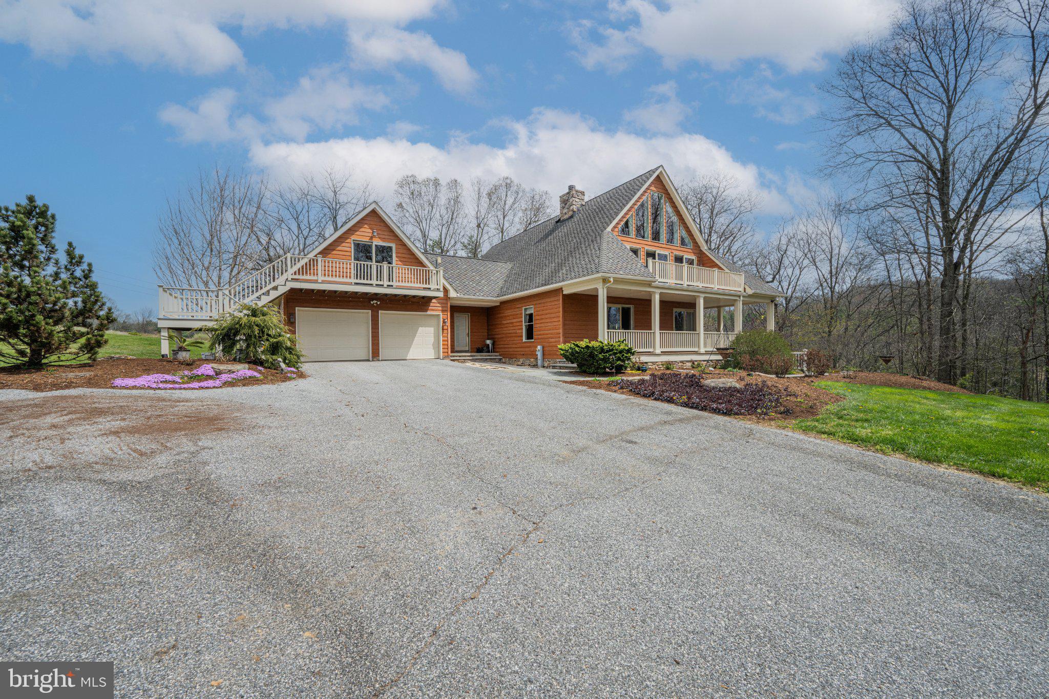 21042 Millers Mill Road Freeland, MD 21053 - Photo 56 of 122 a front view of a house with a garden and trees