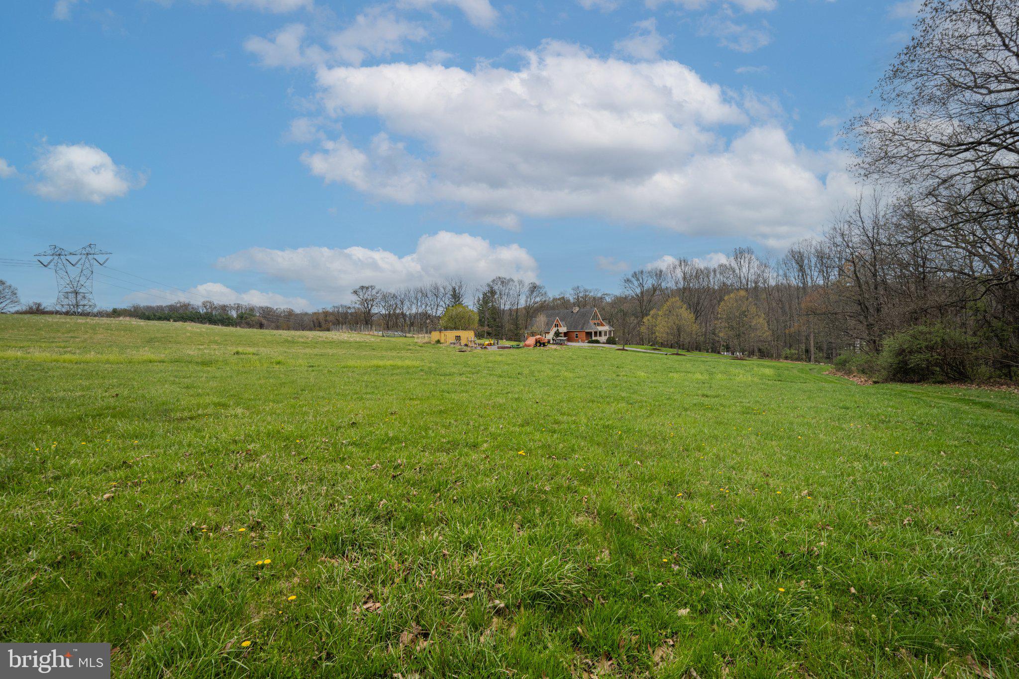 21042 Millers Mill Road Freeland, MD 21053 - Photo 58 of 122 Expansive green landscape under blue skies.