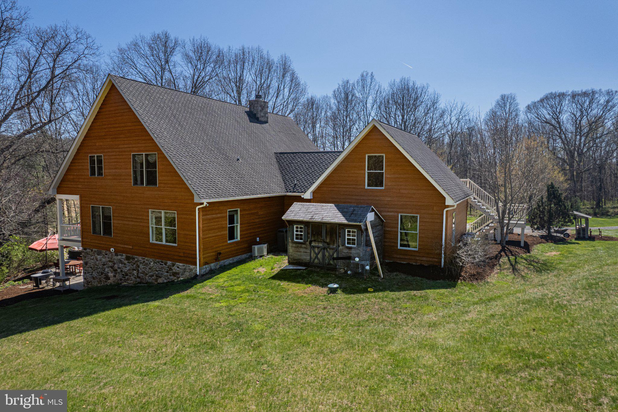 21042 Millers Mill Road Freeland, MD 21053 - Photo 7 of 122 a front view of house with yard and trees in the background