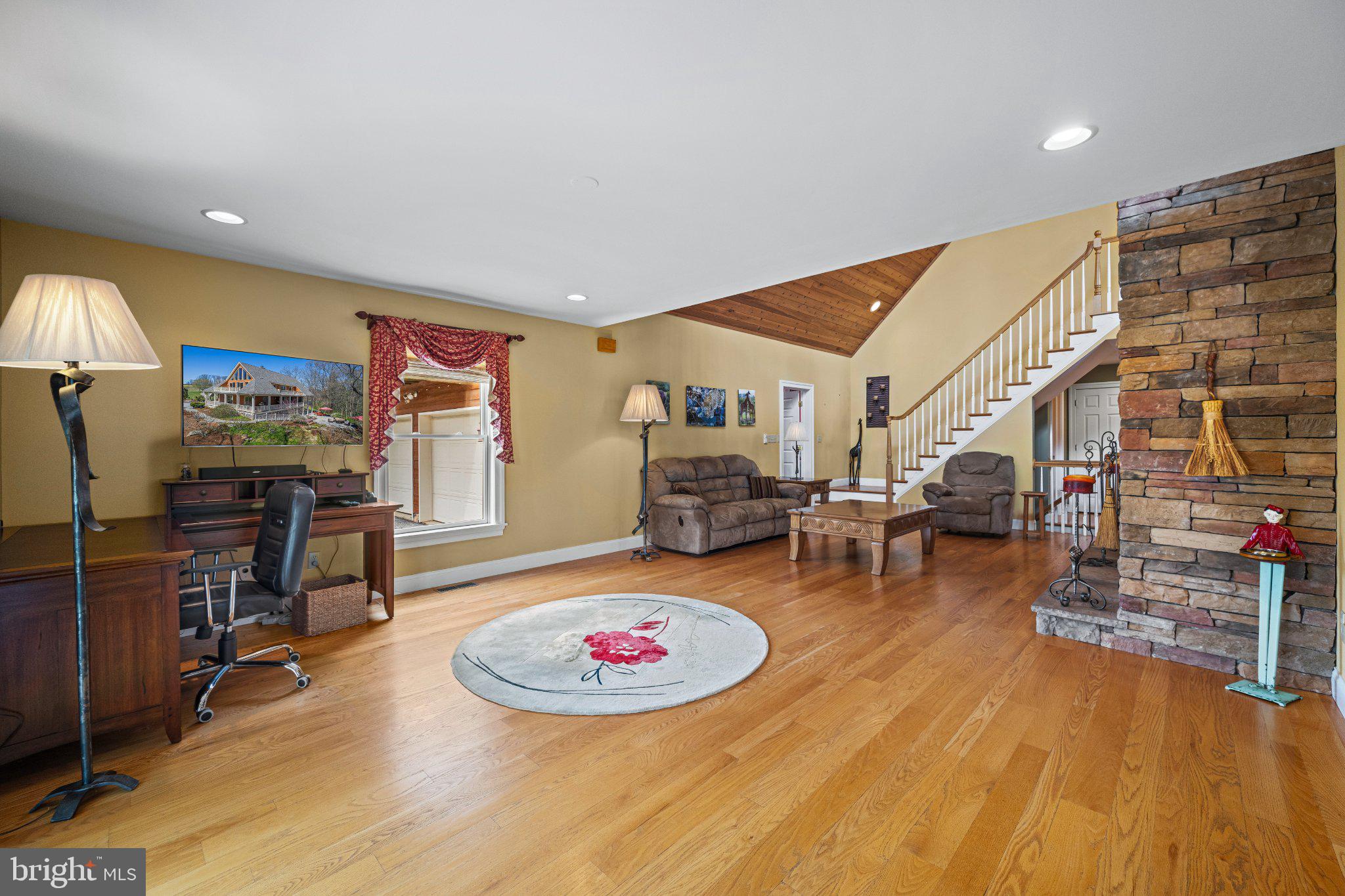 21042 Millers Mill Road Freeland, MD 21053 - Photo 71 of 122 a living room with furniture and a flat screen tv