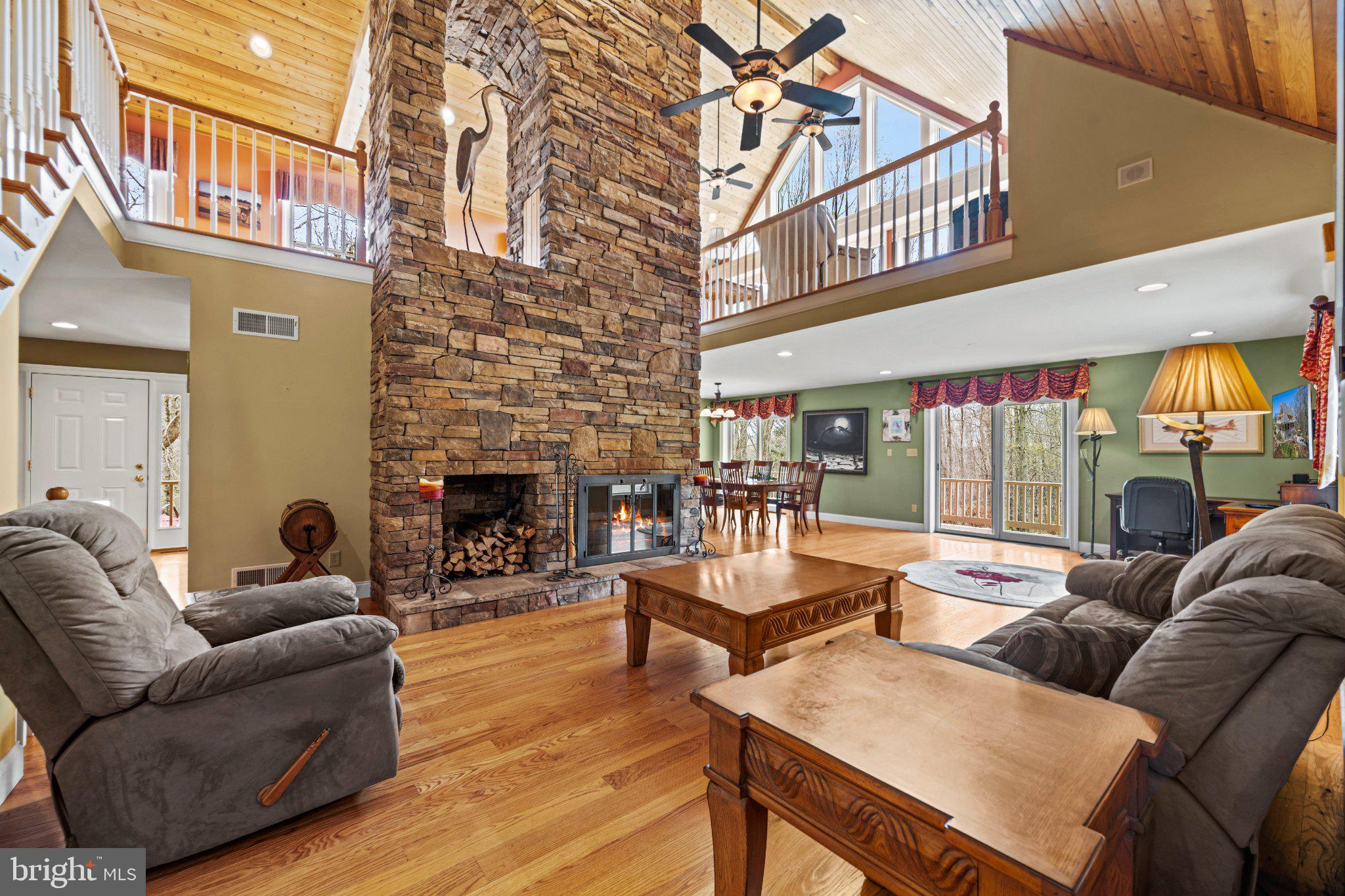 21042 Millers Mill Road Freeland, MD 21053 - Photo 78 of 122 a living room with fireplace furniture and a wooden floor