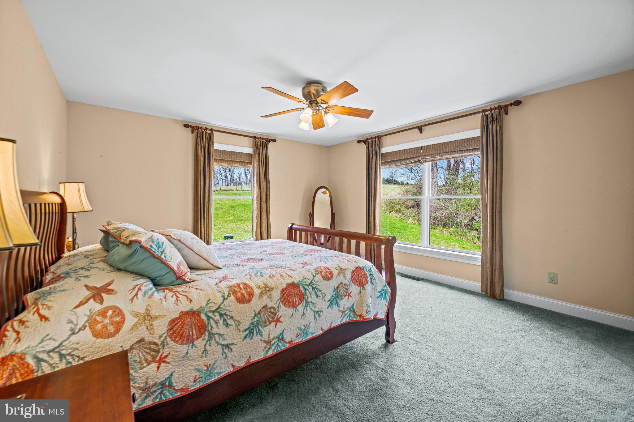 21042 Millers Mill Road Freeland, MD 21053 - Photo 91 of 122 a bedroom with a bed and a chandelier