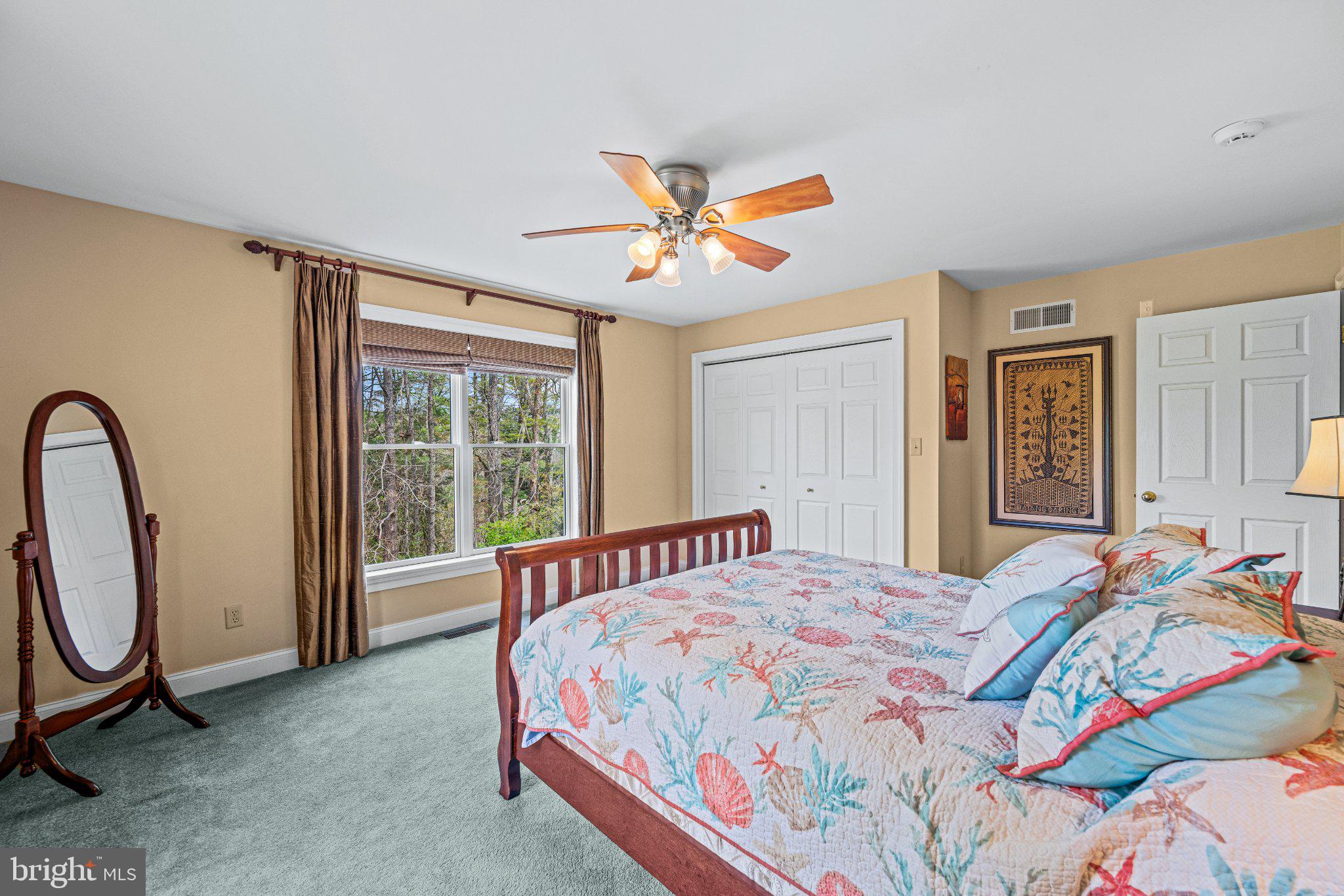 21042 Millers Mill Road Freeland, MD 21053 - Photo 92 of 122 a bedroom with a bed a painting on the wall and a large window