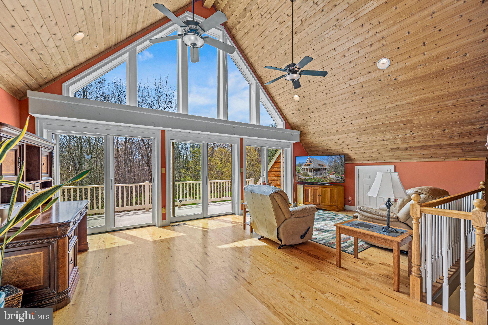21042 Millers Mill Road Freeland, MD 21053 - Photo 99 of 122 a view of a roof deck with chair and wooden floor