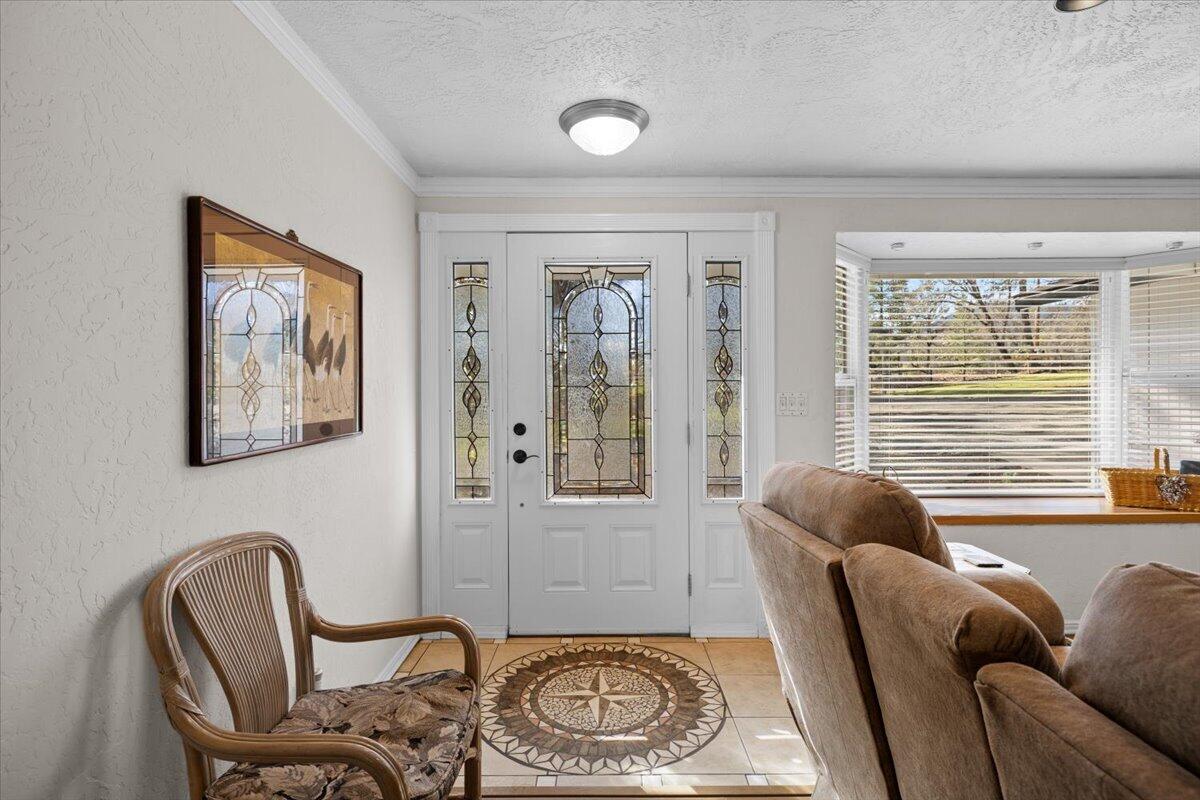 324 China Gulch Road Jacksonville, OR 97530 - Photo 6 of 45 a living room with furniture and a window