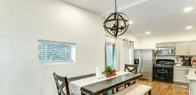 a view of a livingroom with furniture and window