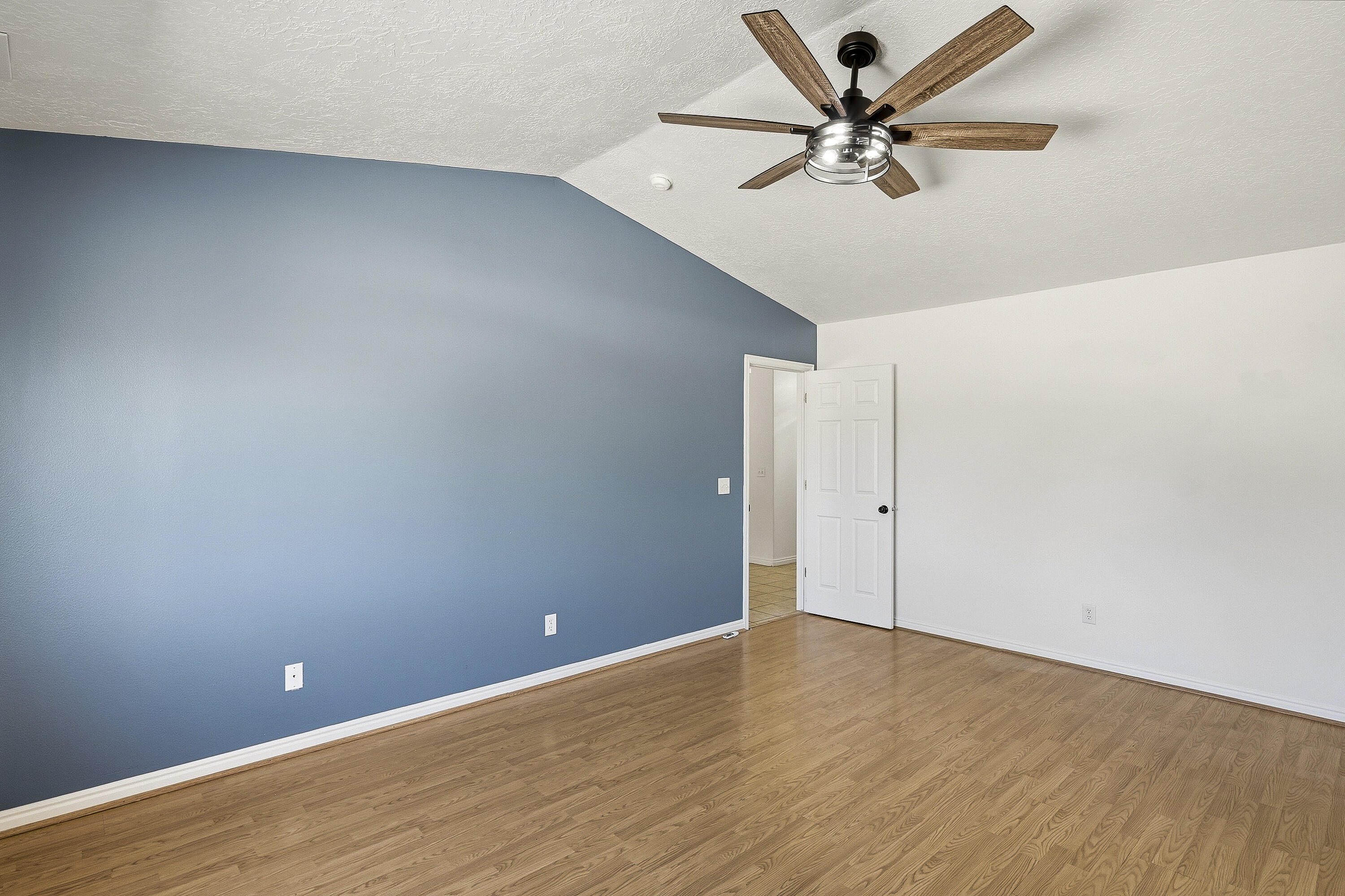 4510 North Half Mile Road Cedar City, UT 84721 - Photo 17 of 48 This space features laminate flooring, vaulted ceilings, and a private ensuite bath.