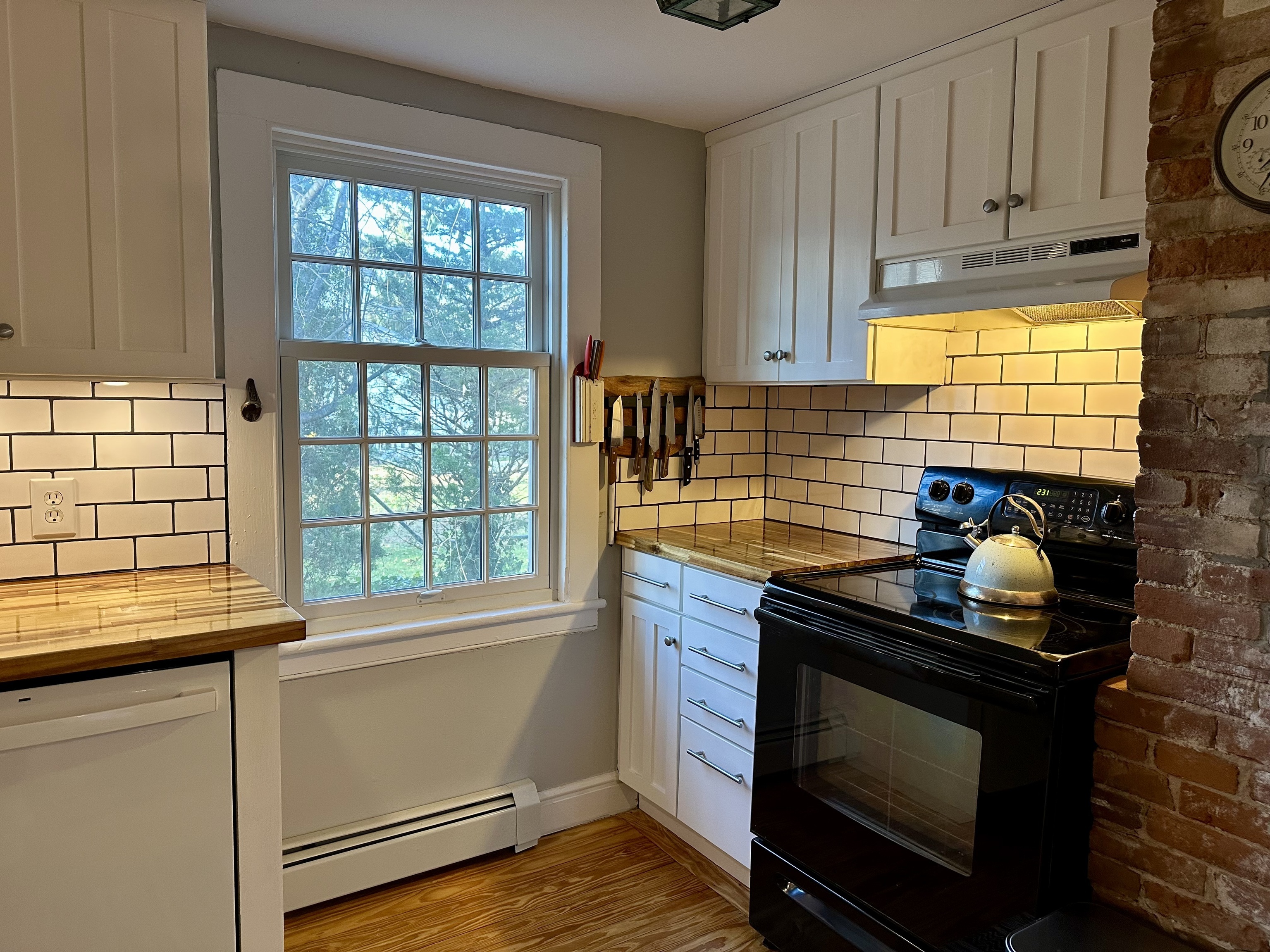 43 Pennywise Lane Old Saybrook, CT 06475 - Photo 19 of 31 a kitchen with granite countertop a stove and a sink