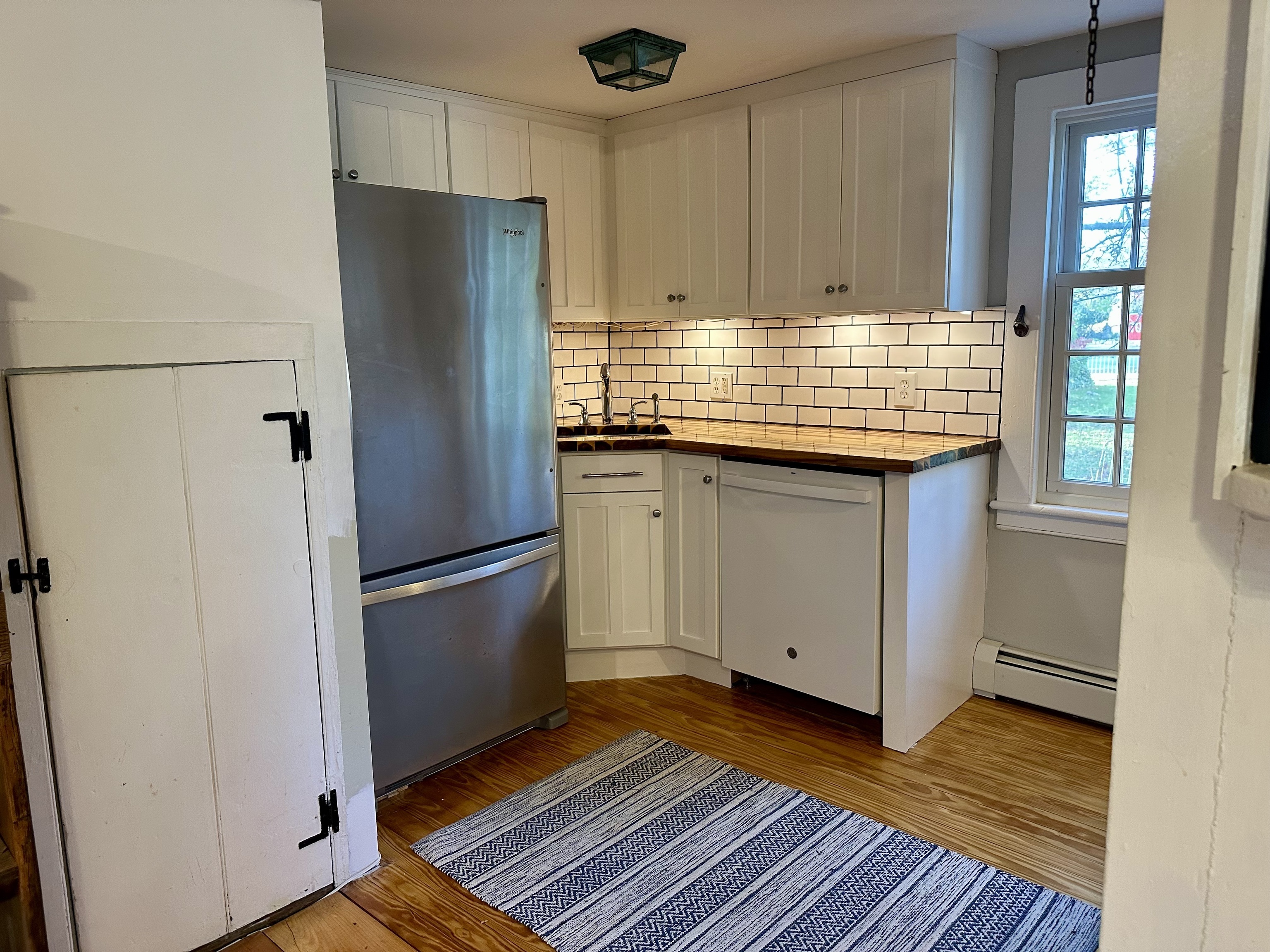 43 Pennywise Lane Old Saybrook, CT 06475 - Photo 20 of 31 a kitchen with granite countertop a refrigerator and a sink