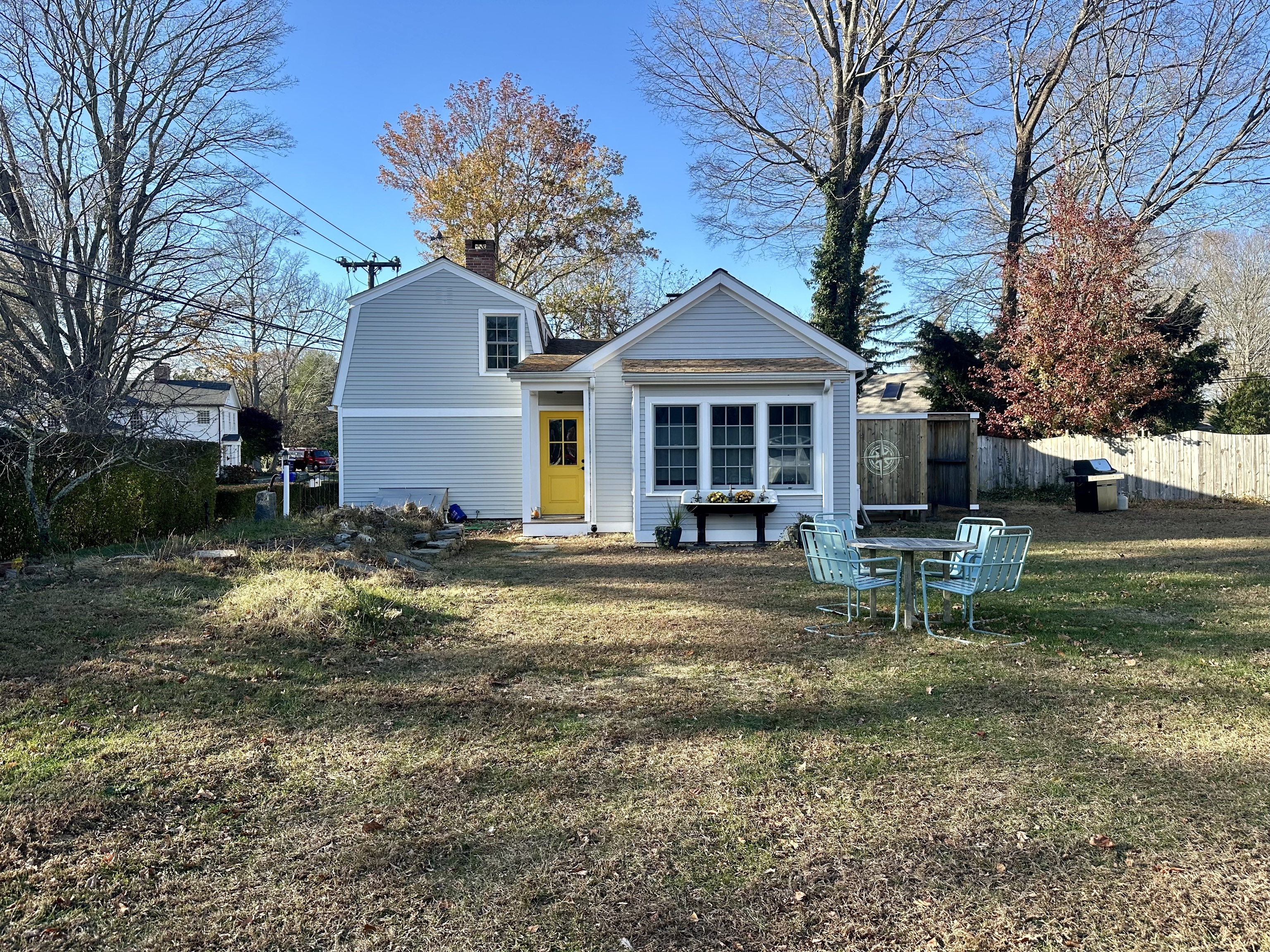 43 Pennywise Lane Old Saybrook, CT 06475 - Photo 2 of 31 a front view of a house with a yard tree and outdoor seating