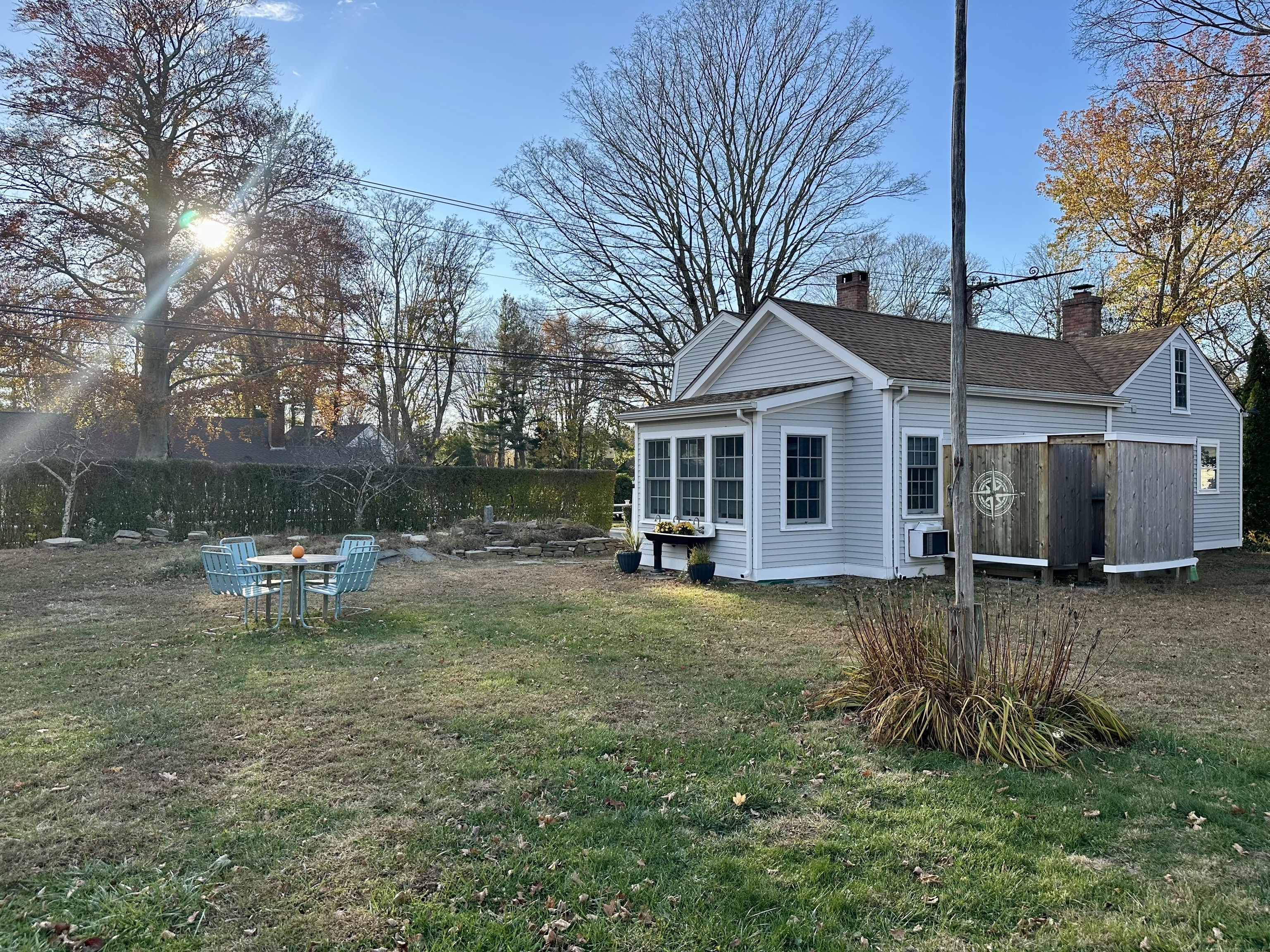 43 Pennywise Lane Old Saybrook, CT 06475 - Photo 3 of 31 a backyard of a house with table and chairs