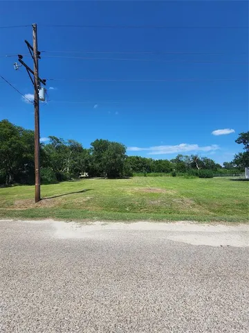 a view of a field with sitting area