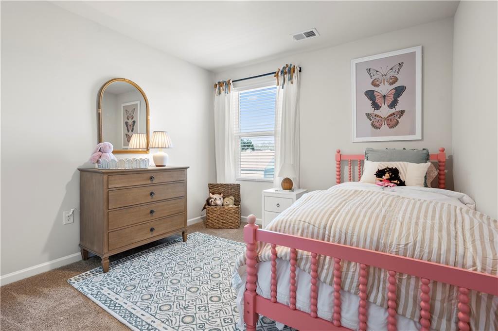 11531 Kimberly Court Hampton, GA 30228 - Photo 25 of 29 a bedroom with a bed and a dresser