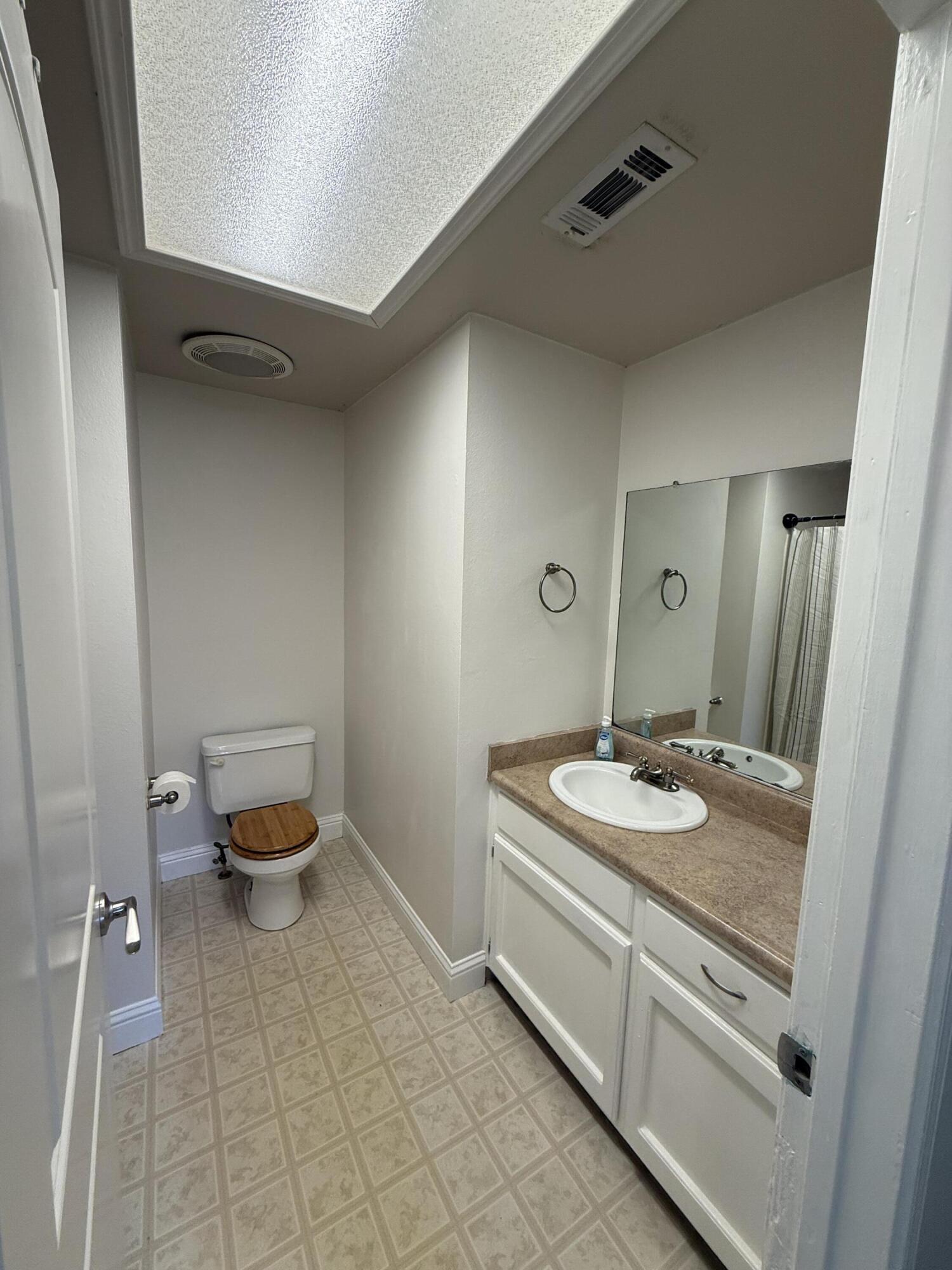 17140 Evergreen Road Cottonwood, CA 96022 - Photo 13 of 32 a spacious bathroom with a sink and a toilet