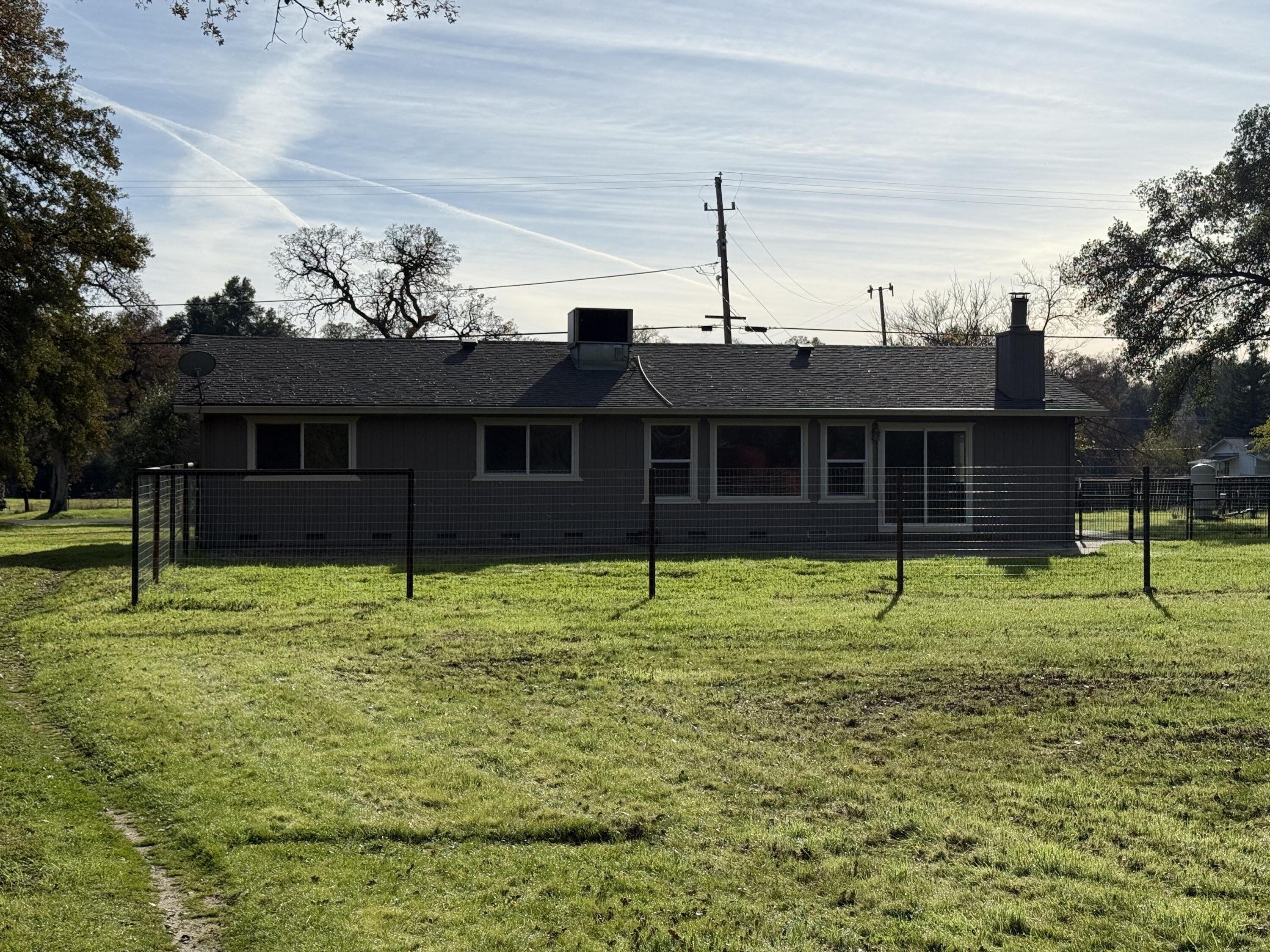 17140 Evergreen Road Cottonwood, CA 96022 - Photo 22 of 32 a house view with a garden space