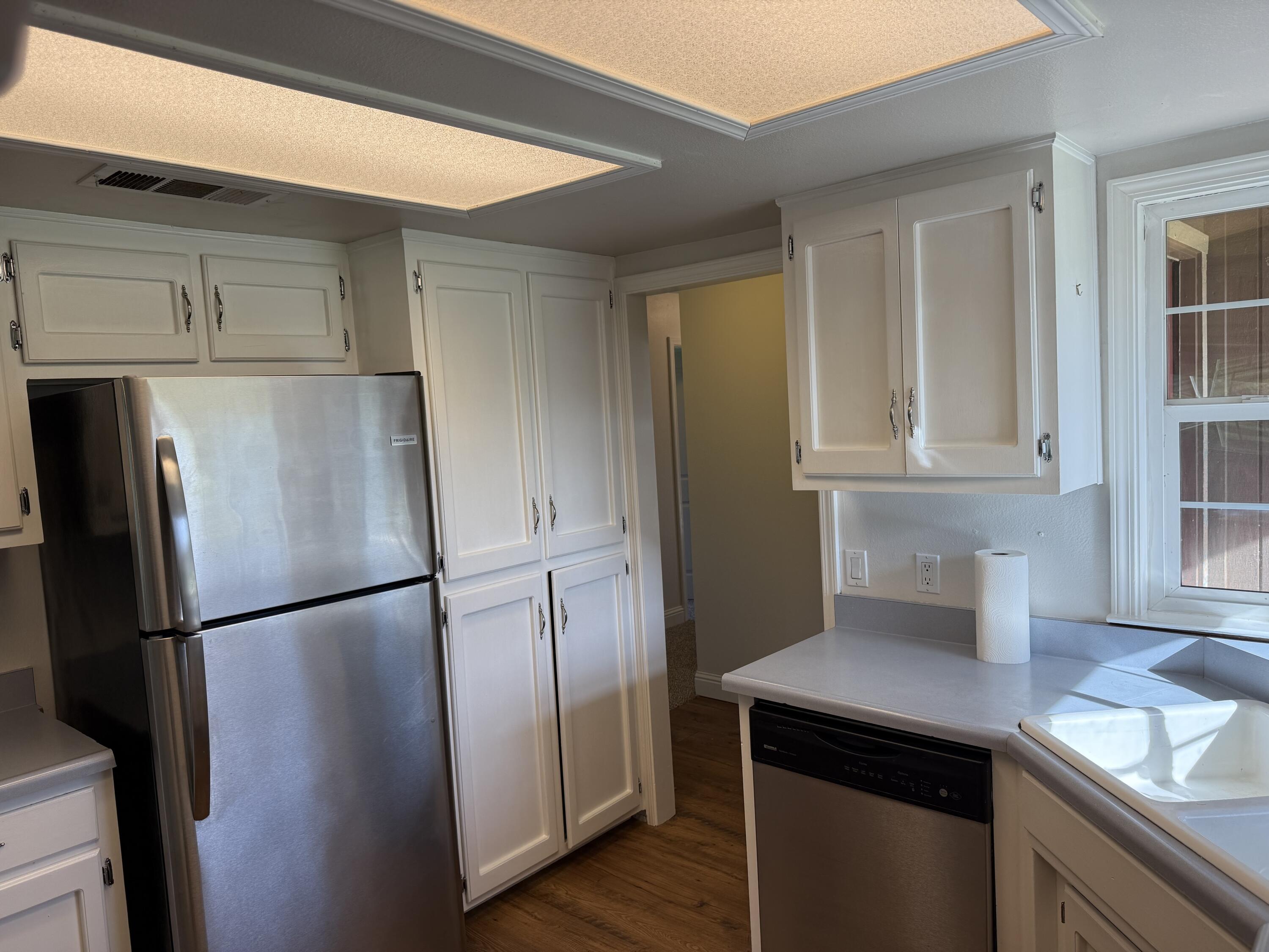 17140 Evergreen Road Cottonwood, CA 96022 - Photo 4 of 32 a kitchen with stainless steel appliances granite countertop a refrigerator and a sink