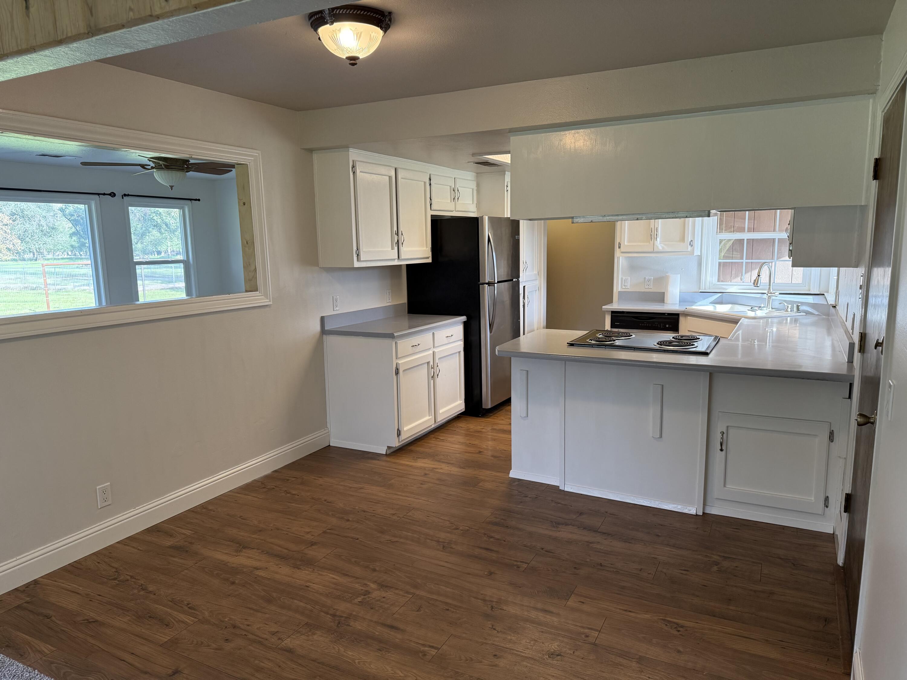 17140 Evergreen Road Cottonwood, CA 96022 - Photo 6 of 32 a kitchen with stainless steel appliances granite countertop a stove a sink and a refrigerator