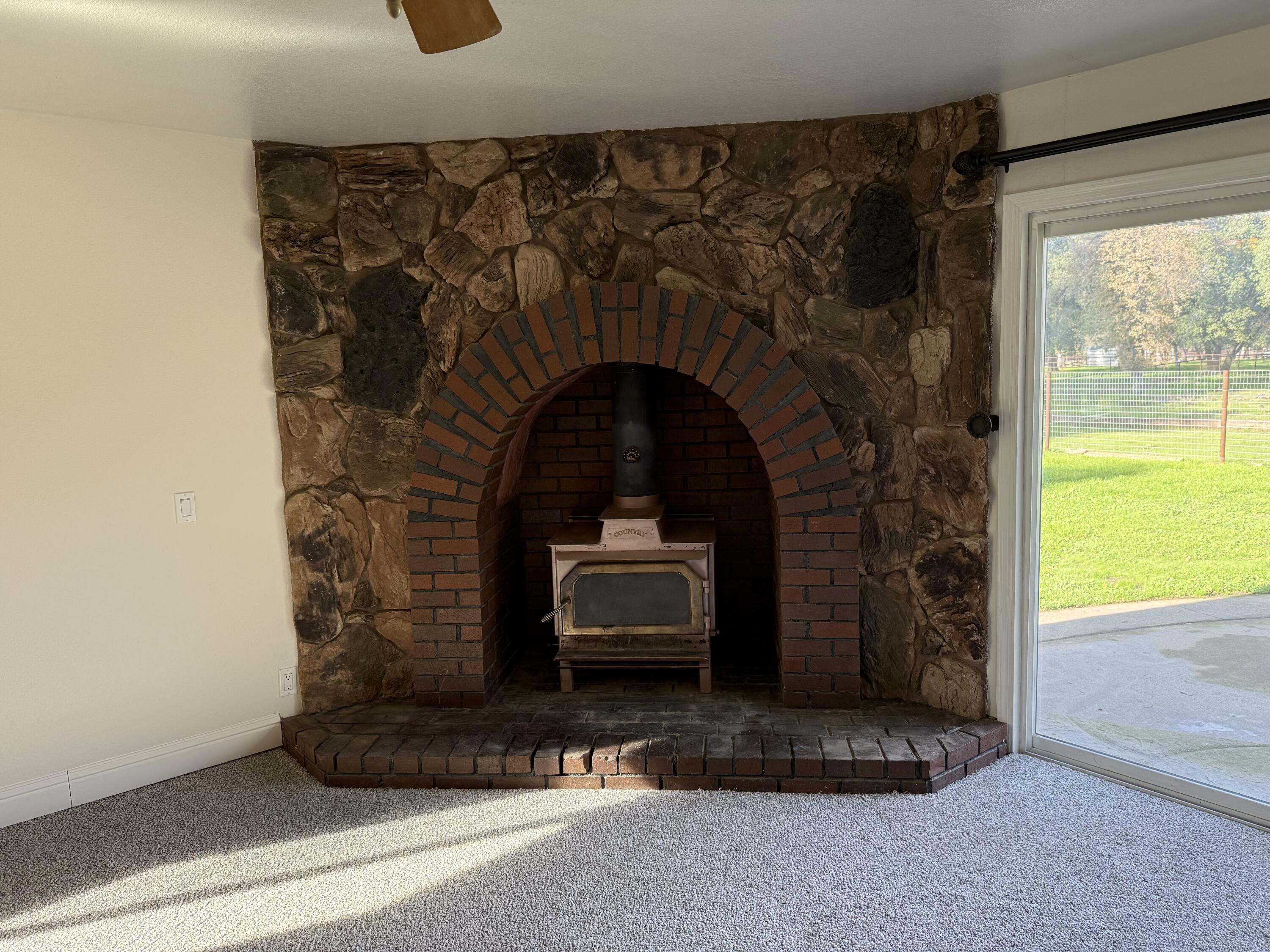 17140 Evergreen Road Cottonwood, CA 96022 - Photo 9 of 32 a front view of a house with a garden