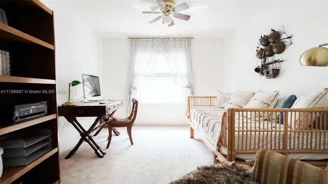 a bedroom with furniture and a fireplace