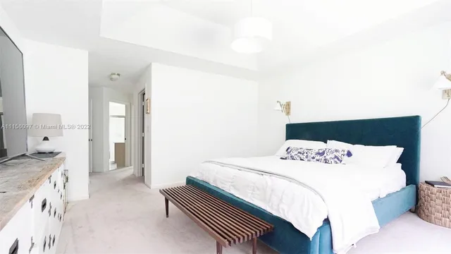 a bedroom with a bed and a cabinets